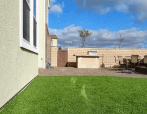 Synthetic Turf Northwest - example of window reflection damage right next to a window on the side of the house