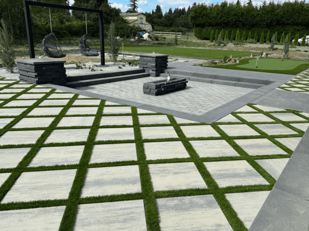 Synthetic Turf between pavers in a back yard
